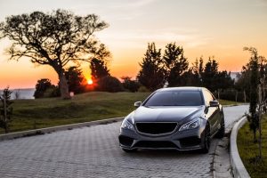 grey-luxury-sedan-car-sunset_114579-4045